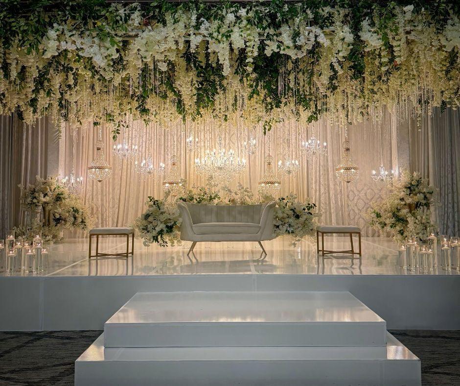 Bride and groom sitting corner by Nagar Events